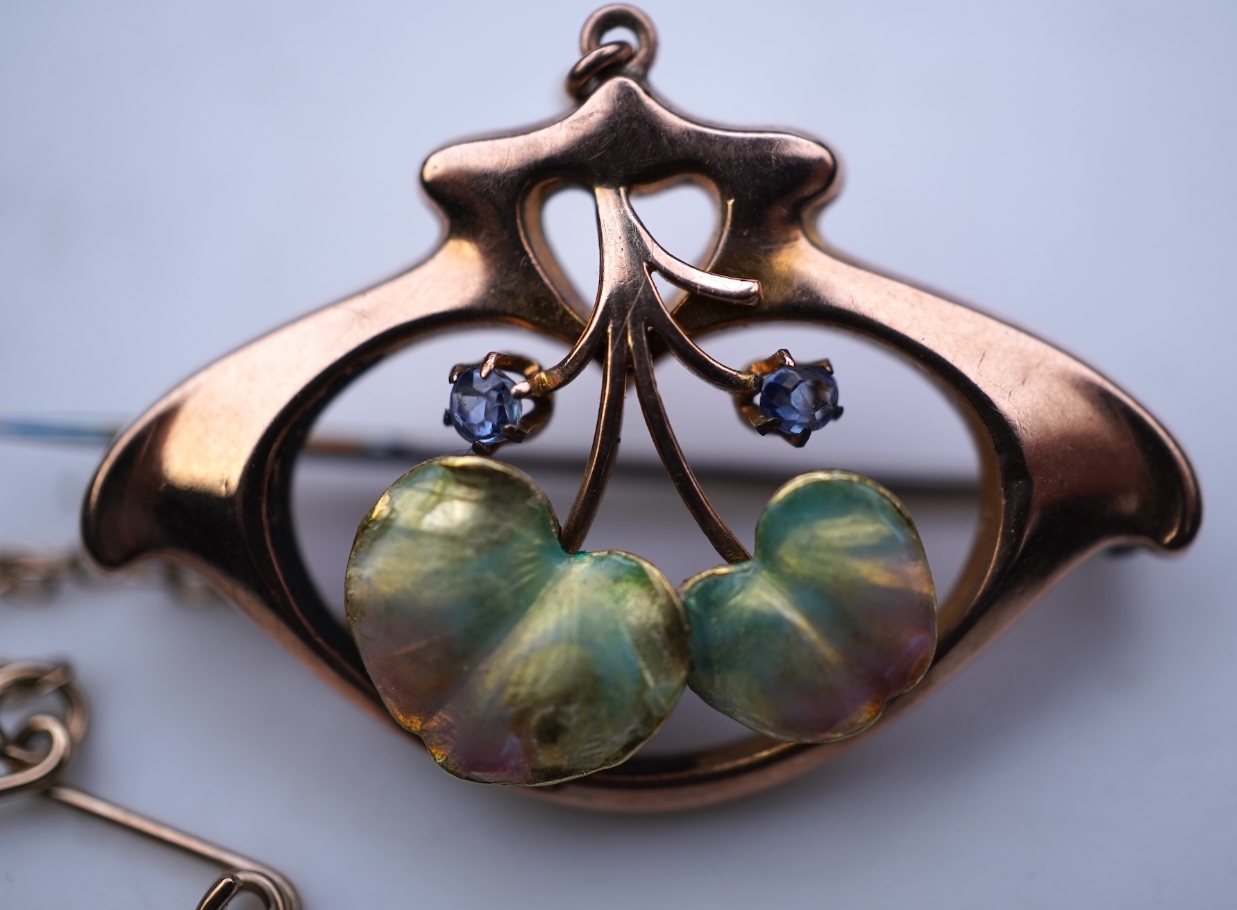 An attractive Art Nouveau enamel, sapphire and seed pearl brooch, early 20th century